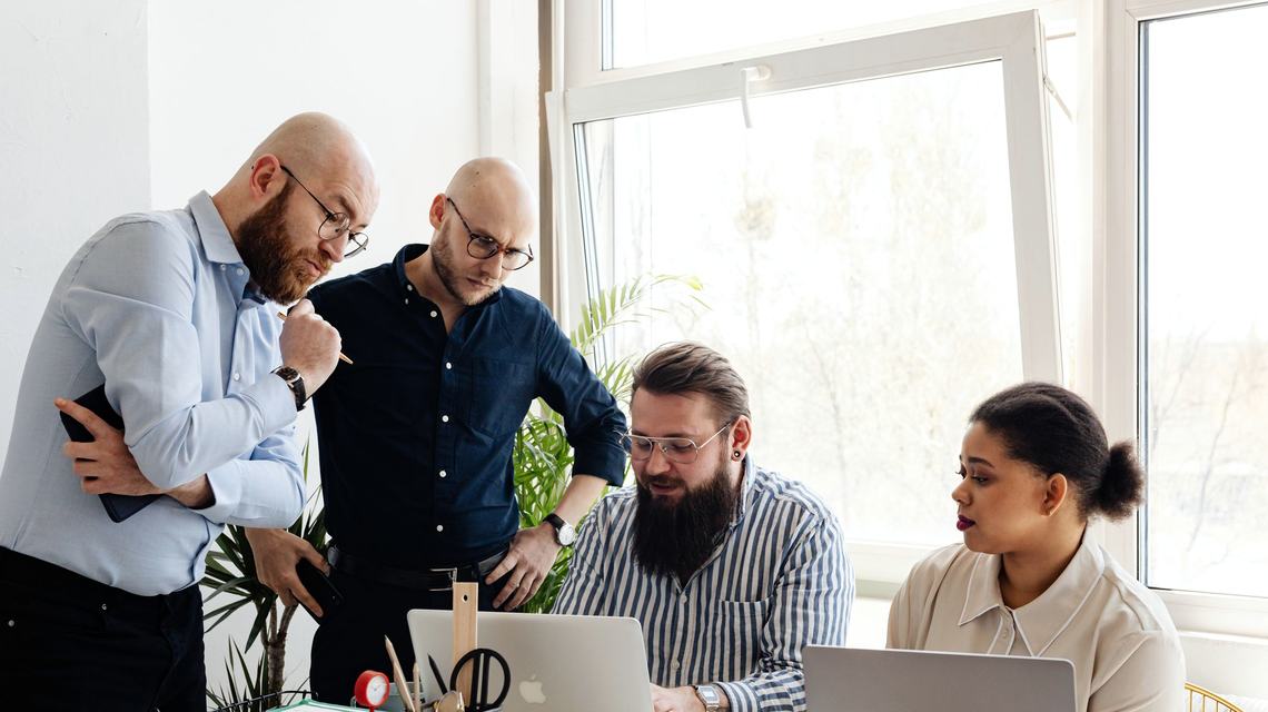 A small team working together in a bright office